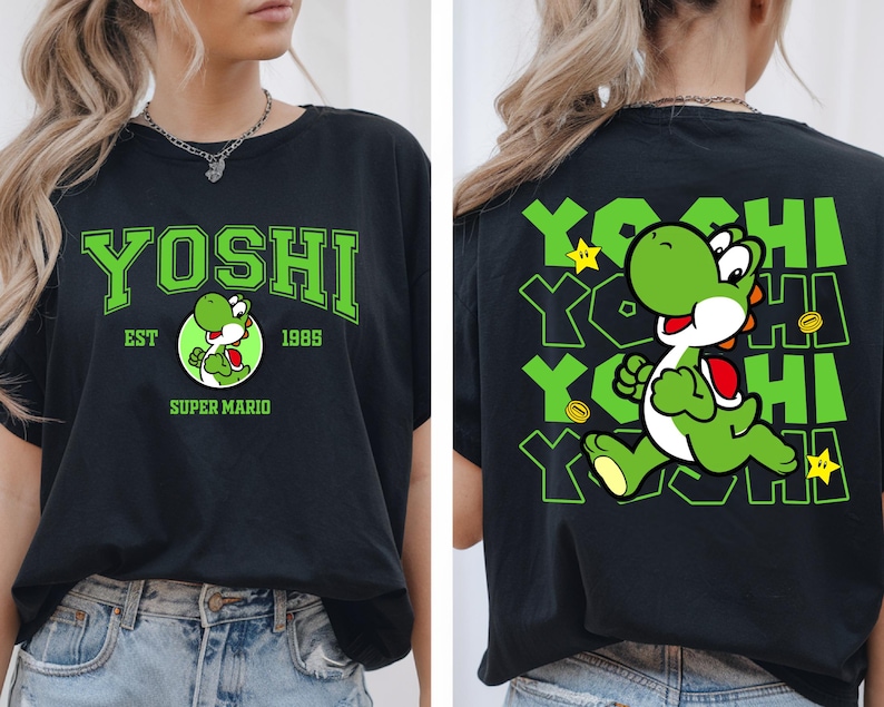 May include: Black t-shirt featuring a green Yoshi graphic from Super Mario. The front displays "YOSHI" in green block letters, with "EST 1985" and a Yoshi character illustration. The back shows a running Yoshi with "YOSHI" repeated.