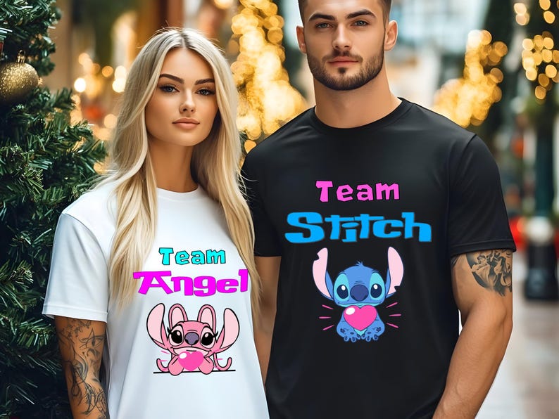 May include: Two people wearing matching t-shirts. One shirt is white with "Team Angel" and a pink cartoon character. The other shirt is black with "Team Stitch" and a blue cartoon character. Both characters are holding hearts.