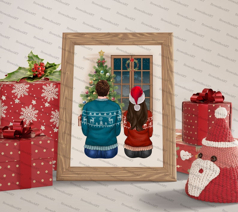 May include: A framed illustration of a couple standing in front of a Christmas tree and looking out a window. The man is wearing a blue sweater with a reindeer pattern and the woman is wearing a red sweater with a snowflake pattern. The couple is standing in front of a Christmas tree with ornaments and lights. The window is decorated with a wreath and the night sky is visible outside.