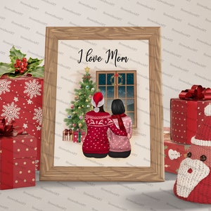 May include: A framed illustration of two people in red and pink sweaters standing in front of a Christmas tree and a window with a snowy scene. The text "I love Mom" is written above the people.