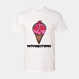 May include: White t-shirt with a pink and white ice cream cone with a skull face and the text "DOTWORKSTUDIOS" in black dripping letters.