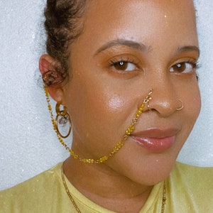 Nose ring that connects to ear top