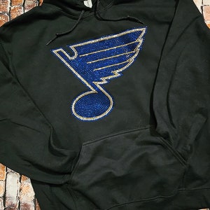 May include: Black hoodie with a blue and gold rhinestone St. Louis Blues logo.