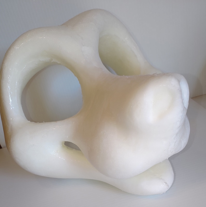 May include: White unfinished resin blank fursuit head base with two eye holes and a nose hole.