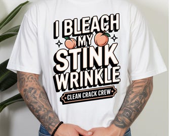 May include: A white short-sleeved t-shirt featuring the black text I BLEACH MY STINK WRINKLE with two peach illustrations and a rectangular banner at the bottom containing the text CLEAN CRACK CREW in black lettering on a light peach background.