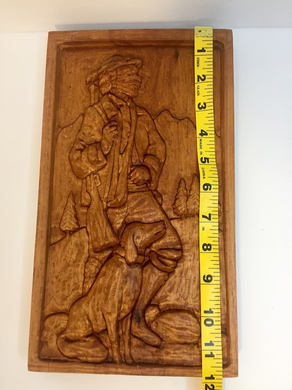 Relief Carving of Bavarian Hunter with Rifle on shoulder Walking with Dog