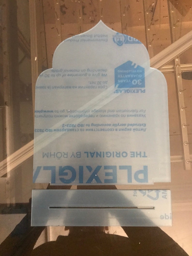 May include: A clear plastic sheet with the text "PLEXIGLAS" and "THE ORIGINAL BY R&Ouml;HM" printed on it. The sheet also has the text "30 YEARS GUARANTEE NO VELLOWING" printed on it.