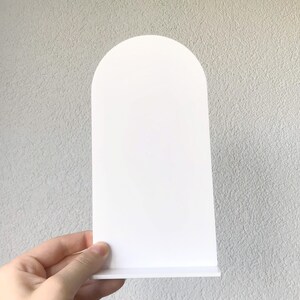May include: White arched sign with a flat base. The sign is blank and ready for personalization.
