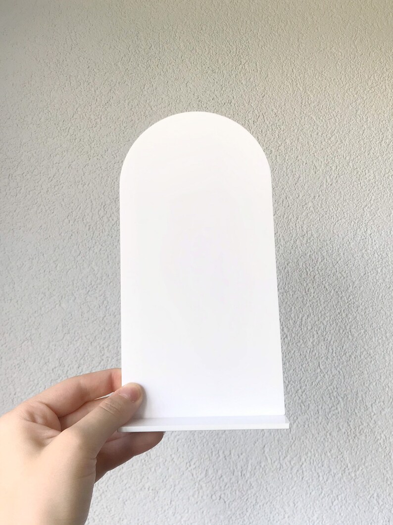 May include: White arched sign with a flat base. The sign is blank and ready for personalization.