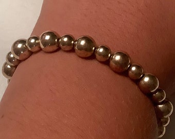 Bracciale elasticizzato perline d'oro