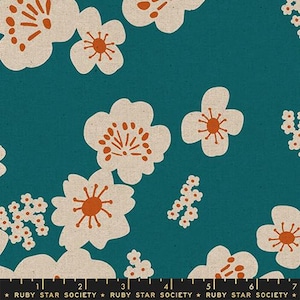 May include: Teal fabric with a repeating floral pattern. Large off-white flowers with orange centers and smaller white floral clusters are scattered across the surface. The text "RUBY STAR SOCIETY" is printed at the bottom.