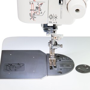 close up image of the Janome HD9 Sewing Machine needle plate