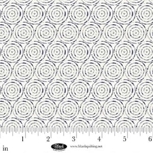 May include: Cream-colored fabric with a repeating pattern of navy blue concentric circles. The circles have a textured, dotted appearance, creating a visual texture. The fabric is measured in inches.