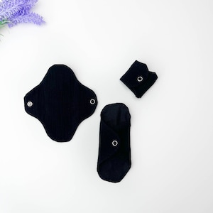 Schwarze Bio-Slipeinlagen, Damenbinden mit leicht fließendem Stoff, wiederverwendbare weiche Flanellpads