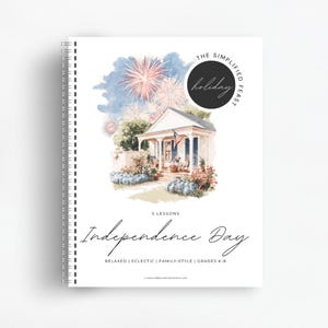 May include: A spiral-bound workbook titled The Simplified Feast Independence Day with 5 lessons for grades K-8. The cover features a watercolor illustration of a house with an American flag on the porch and fireworks in the sky above.