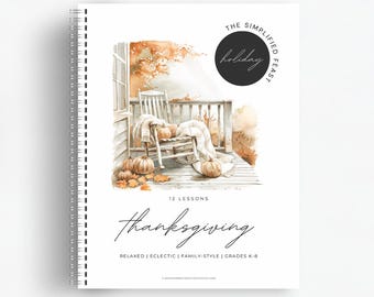 May include: A watercolor illustration of a porch with rocking chairs and pumpkins. The text "The Simplified Holiday Feast" and "12 Lessons Thanksgiving" is printed on the page. The text "Relaxed | Eclectic | Family-Style | Grades K-8" is also printed on the page.