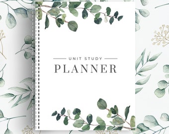 May include: A white planner with a green eucalyptus leaf design and the text "UNIT STUDY PLANNER" on the front cover.