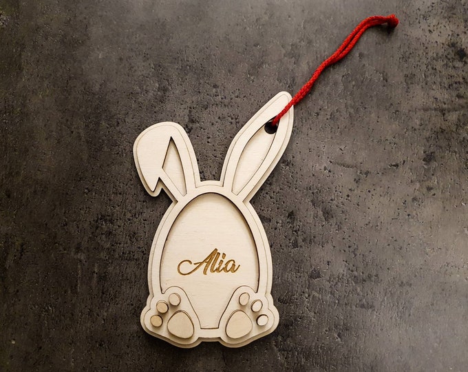 personalized wooden pendant in the shape of a rabbit. Made from three layers of high-quality, 3 mm birch plywood, individual name engraving