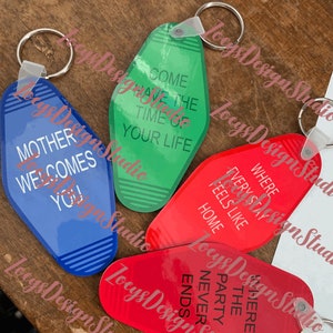 May include: Four motel-style keychains in blue, green, and red. Each keychain has a different phrase in white text: "Mother Welcomes You!", "Come Have The Time Of Your Life", "Where Every Stay Feels Like Home", and "Where The Party Never Ends".