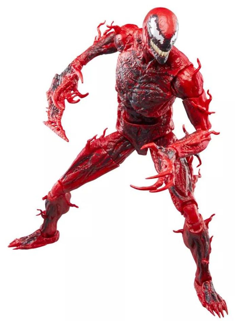 May include: A red action figure of the Marvel Comics character Carnage. The figure is in a dynamic pose, with a detailed sculpt featuring a textured, symbiote-like appearance. The figure has a white and black face and sharp, claw-like appendages.