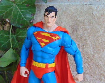 Classic DC Comics Costume Iconic SUPERMAN Action Figure, 7  Inch Collectible, Red Cape Blue Suit Figure, Shelf Display Decor