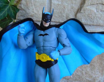 DC Comics First Appearances Costume Batman Action Figure, 7 Inch Collectible,  Fabric Poseable Wired Cape, Blue Suit Variant DC Superhero
