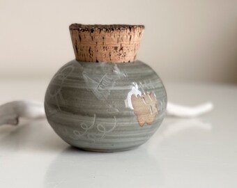 Gray ceramic jar with cork lid. Salt container, sugar dispenser