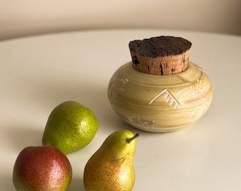 Yellow ceramic jar with cork lid. Salt container. Sugar dispenser