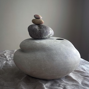 Low ceramic vase. Ikebana vessel