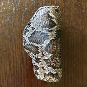 May include: A rustic wooden sign with the text "Welcome to our porch" in white lettering. The sign features a distressed finish and a simple, inviting design, perfect for outdoor decor.