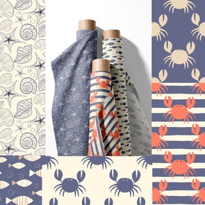 May include: Four rolls of fabric with different nautical themed patterns. The patterns include seashells, starfish, crabs, fish, and stripes. The fabric is a light blue color with white and red accents.