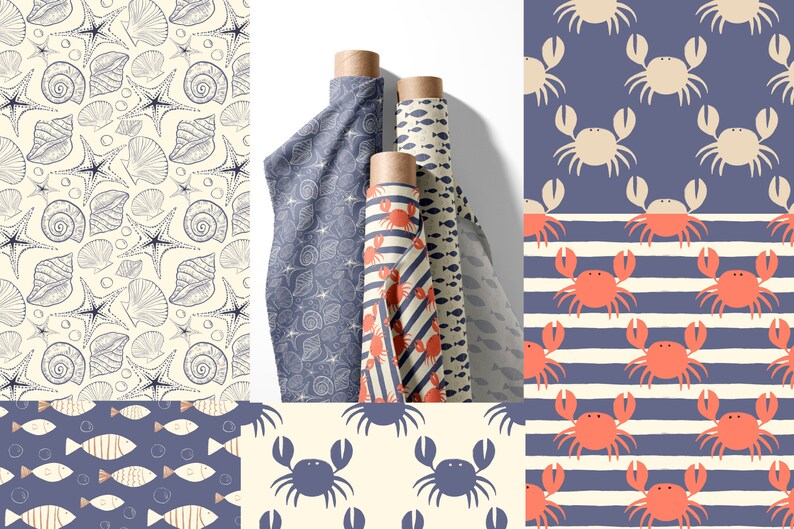 May include: Four rolls of fabric with different nautical themed patterns. The patterns include seashells, starfish, crabs, fish, and stripes. The fabric is a light blue color with white and red accents.