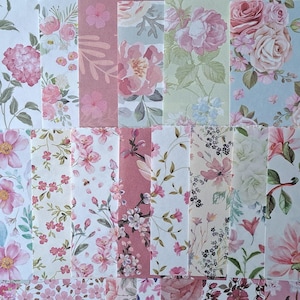 May include: A collection of rectangular paper sheets featuring various floral patterns in shades of pink, green, white, and blue. The designs include watercolour-style illustrations of roses, cherry blossoms, magnolias, and assorted small botanical sprigs.