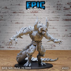 May include: A gray, detailed, 3D printed miniature of a monstrous creature with horns, claws, and a tail. The miniature is posed in a dynamic stance with one arm raised and the other extended. The base size is HUGE (76.5mm). #5003
