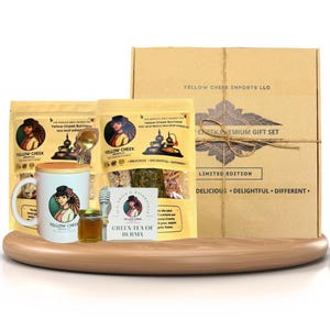 May include: A gift set featuring Yellow Cheek Burmese tea leaf, a mug, honey, and a tea infuser. The set is packaged in a brown box with a label that reads "Yellow Cheek Premium Gift Set, Limited Edition".