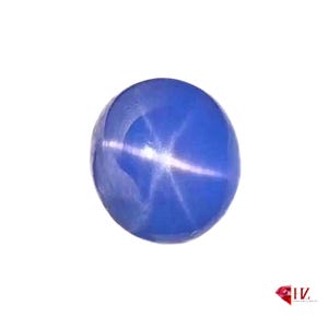 Può includere: Una pietra preziosa di zaffiro blu stellato con un riflesso a forma di stella al centro.