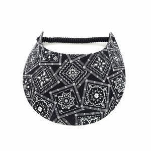 May include: Black visor with a white bandana print. The visor has a black elastic band.