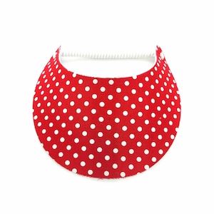 May include: Red visor with white polka dots.