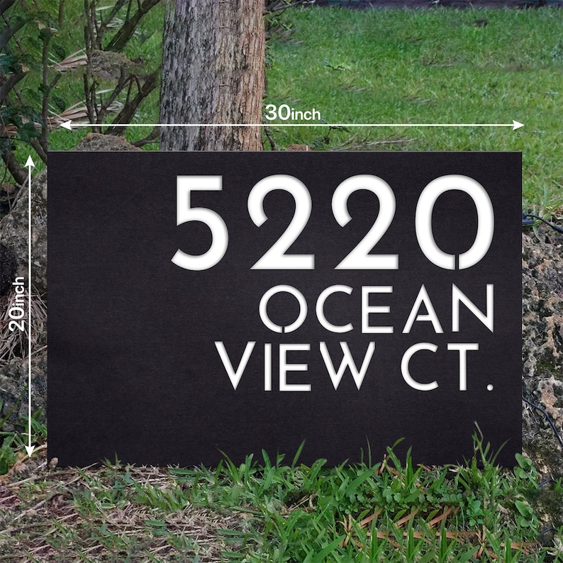May include: Black metal house number sign with white lettering. The sign reads "5220 OCEAN VIEW CT." and measures 76.2 cm wide by 50.8 cm tall.