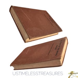 May include: Two antique books with brown covers are displayed against a white background. The books are titled "The Story of the Negro Retold" by Carter Godwin Woodson. The books appear to be vintage and well-preserved.