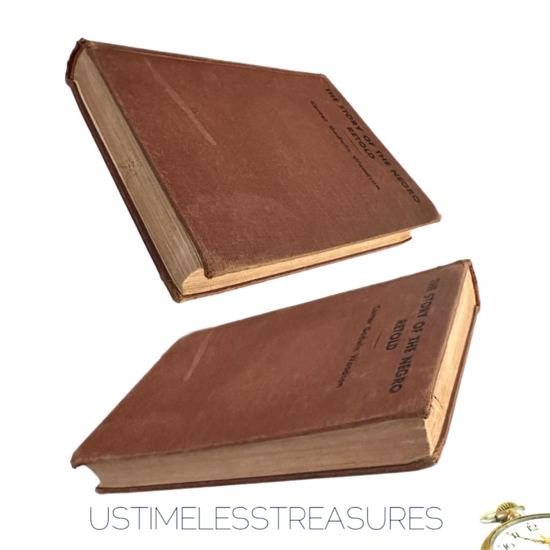 May include: Two antique books with brown covers are displayed against a white background. The books are titled "The Story of the Negro Retold" by Carter Godwin Woodson. The books appear to be vintage and well-preserved.