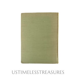 May include: A vintage book with a light green cover. The cover has a textured appearance and a rectangular shape. The text "USTIMELESSTREASURES" is printed at the bottom of the image.