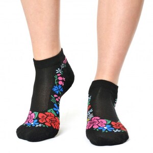 May include: Black ankle socks with a colorful floral pattern around the ankle.