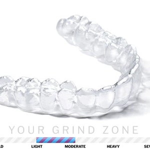 May include: Clear plastic mouth guard for teeth grinding, with a scale showing mild, light, moderate, heavy, and severe levels of teeth grinding.  The scale shows the guard is for moderate teeth grinding.