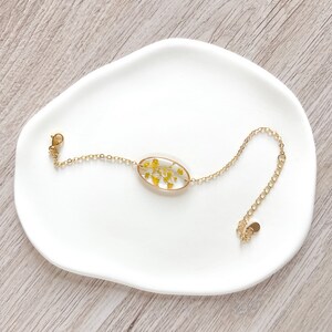 handmade 18k gold plated blacelet with yellow pressed flowers preserved in resin