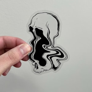 May include: Black and white sticker of a skull with a melting, swirling design. The skull is outlined in black and the swirling design is filled in black.