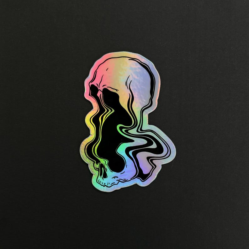 May include: A holographic sticker of a skull with a black, swirling, liquid-like design inside. The skull is outlined in black and has a rainbow iridescent background.