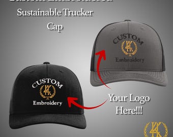 May include: Two custom embroidered trucker caps are shown, one black and one grey. Both caps feature a logo with the text "CUSTOM Embroidery" in white and gold. The caps are designed for sustainability.