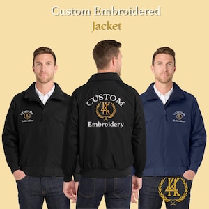 May include: Three custom embroidered jackets in black and navy. The jackets display the text "Custom Embroidery" with a gold emblem. They have a zip-up front and a collar. The image includes the text "Custom Embroidered Jacket".