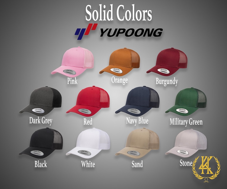 May include: A variety of solid color trucker hats with mesh back panels. The hats are arranged in two rows of five, with the brand name "YUPOONG" printed on the top of the image. The colors include pink, orange, burgundy, dark grey, red, navy blue, military green, black, white, sand, and stone.